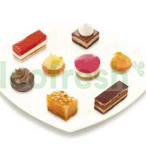 SAINT‑GERMAIN PETITS FOURS ON A TRAY UNDER COVE
